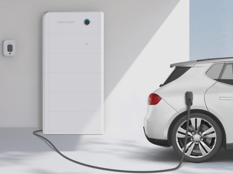 Hands On Electrical installation of a Sigenergy home battery storage system with an electric vehicle charging point in a modern driveway.